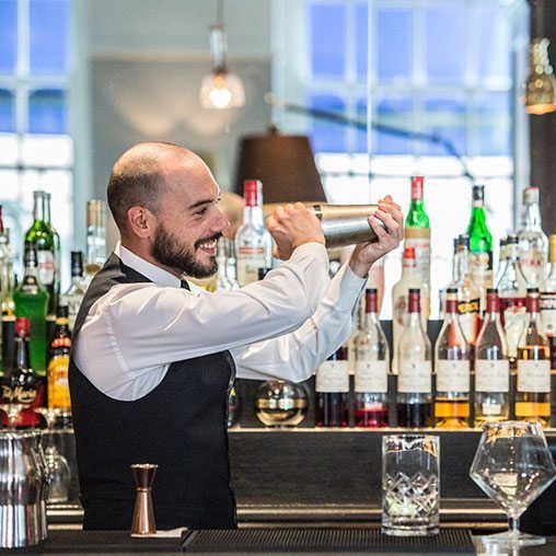A Quarter Bar barman making a cocktail