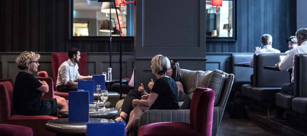 Guests sitting the quarter bar