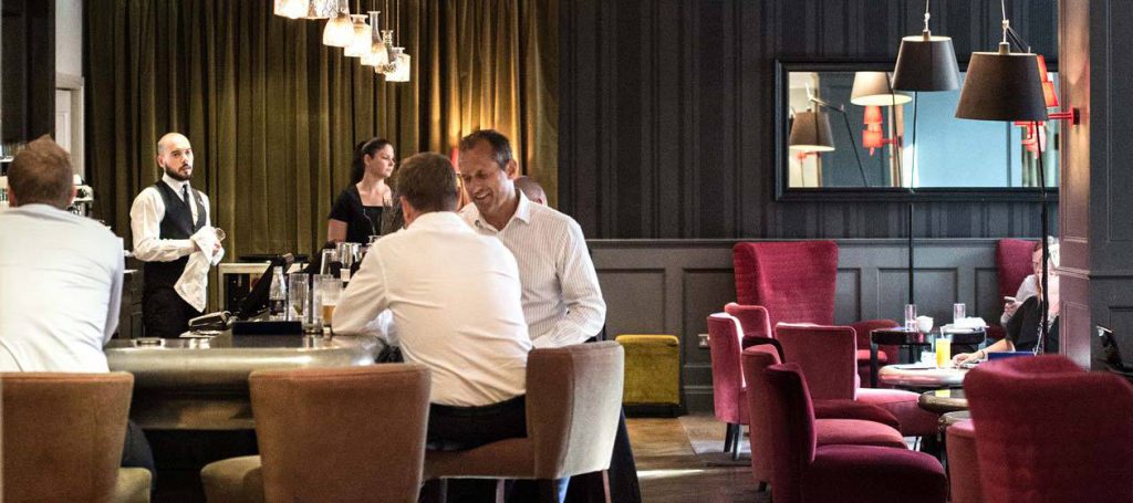 Guests enjoying a drink at the quarter bar