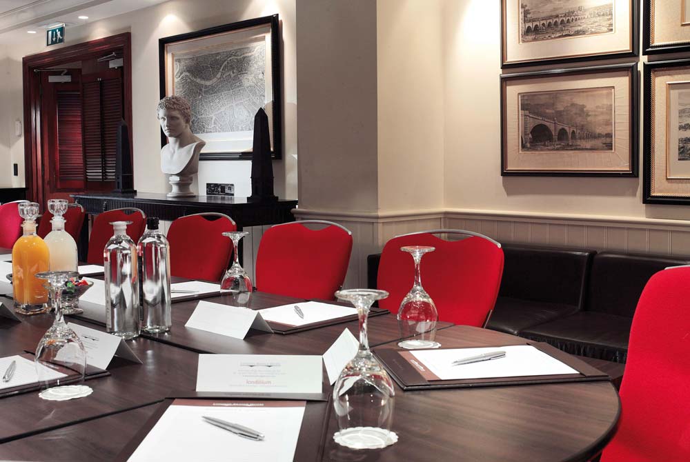 At the head of the Bridge Suite meeting room table